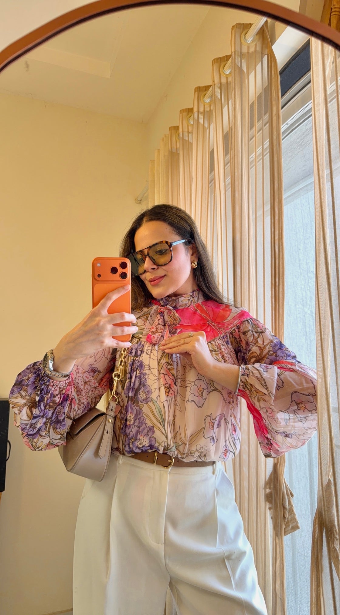 Floral patterned blouse with pink and purple flowers